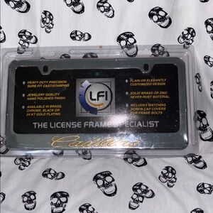 Cadillac Metallic Mirror Finish License Plate Frame Brand New in Packaging.